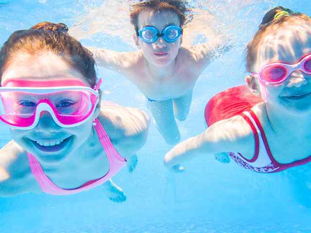Children Swimming Underwater